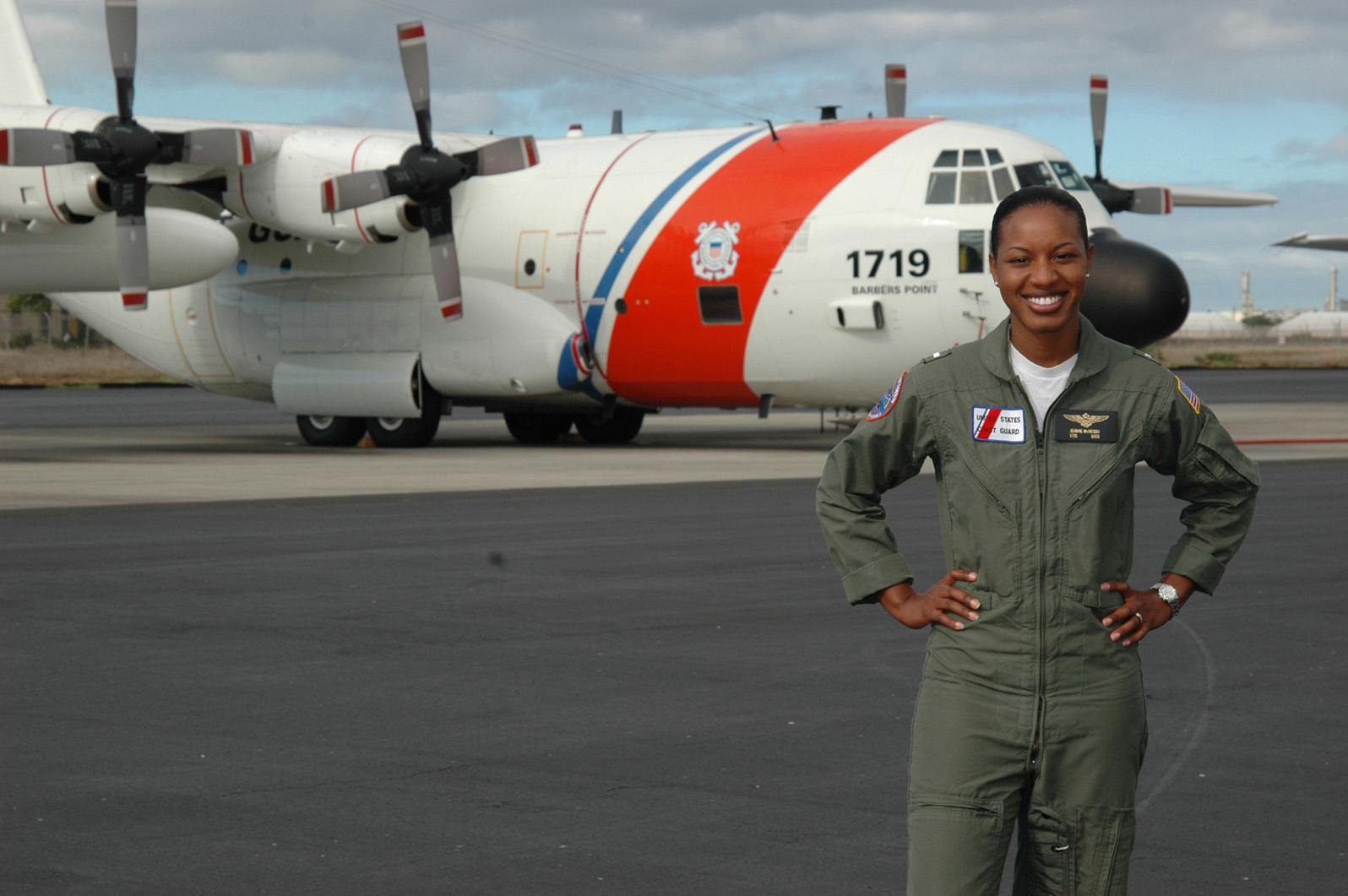 The first African American female pilot in the Coast Guard, LTJG Jeanine McIntosh poses in front of her HC-130. The first African American female pilot in the Coast Guard, LTJG Jeanine McIntosh poses in front of her HC-130.